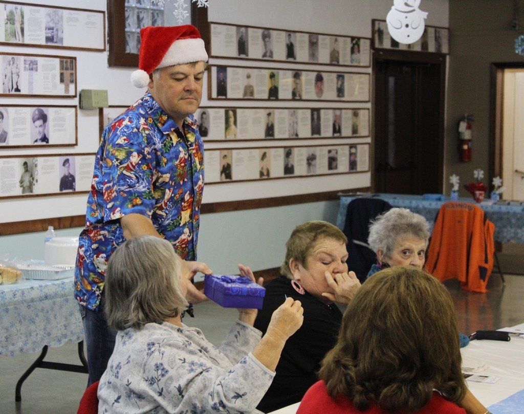 Tom Allan distributes a gift to a senior citizen at the Benld Christmas Dinner. Over 80 were in attendance and over 30 meals were delivered. Read more. 