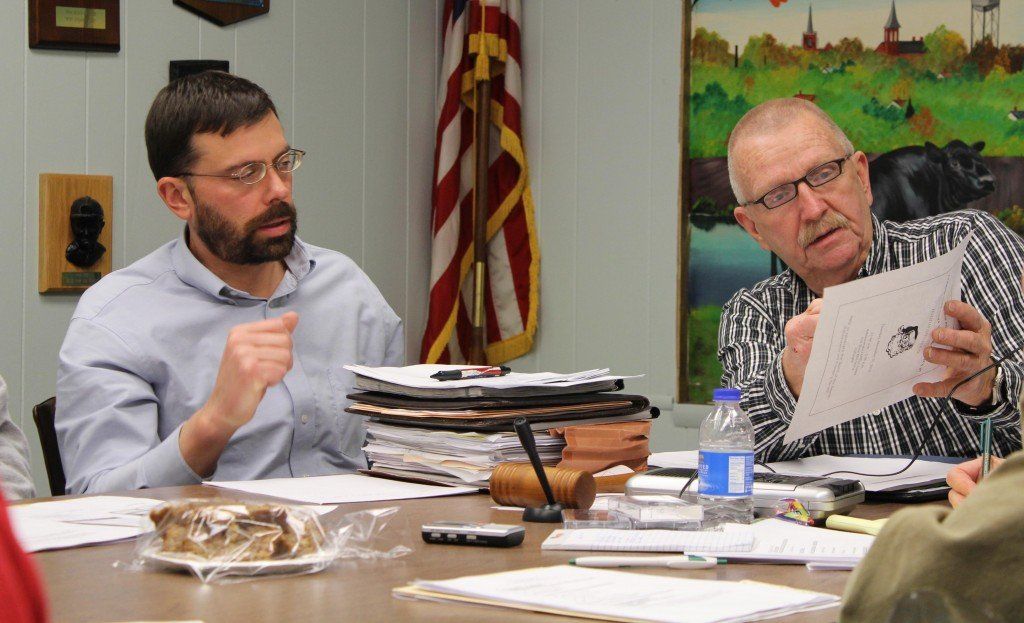 Mayor John Hicks reads over the letter residents will receive about the relining of the sewers.