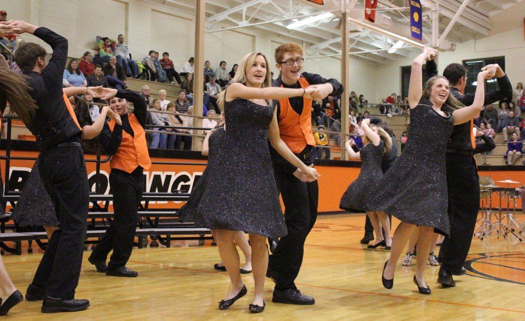 Show Choir members dance, snap, kick and sing together in "Santa Claus Comes to Town". 