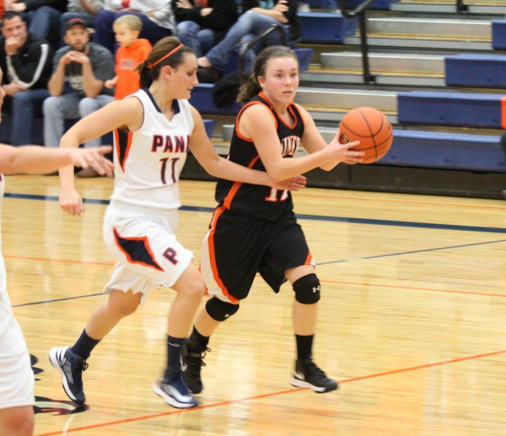 Ellen Gray looks for a teammate to pass it to. 