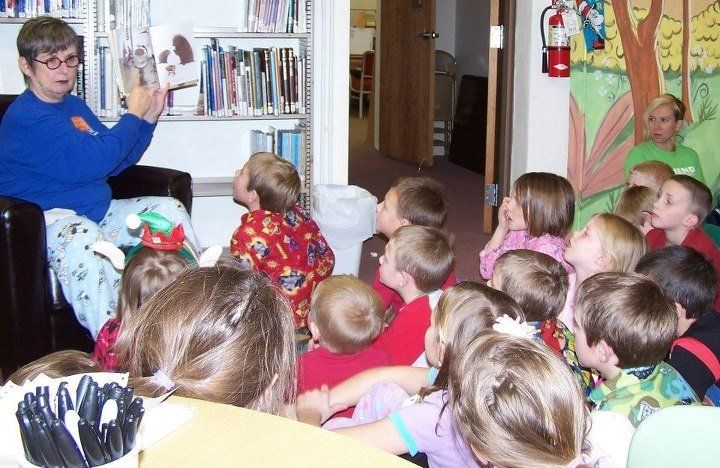 Louann Brown reads a story to kids in pajamas last Monday in part of a 'Friends of the Gillespie' Library event. Like them on Facebook! 