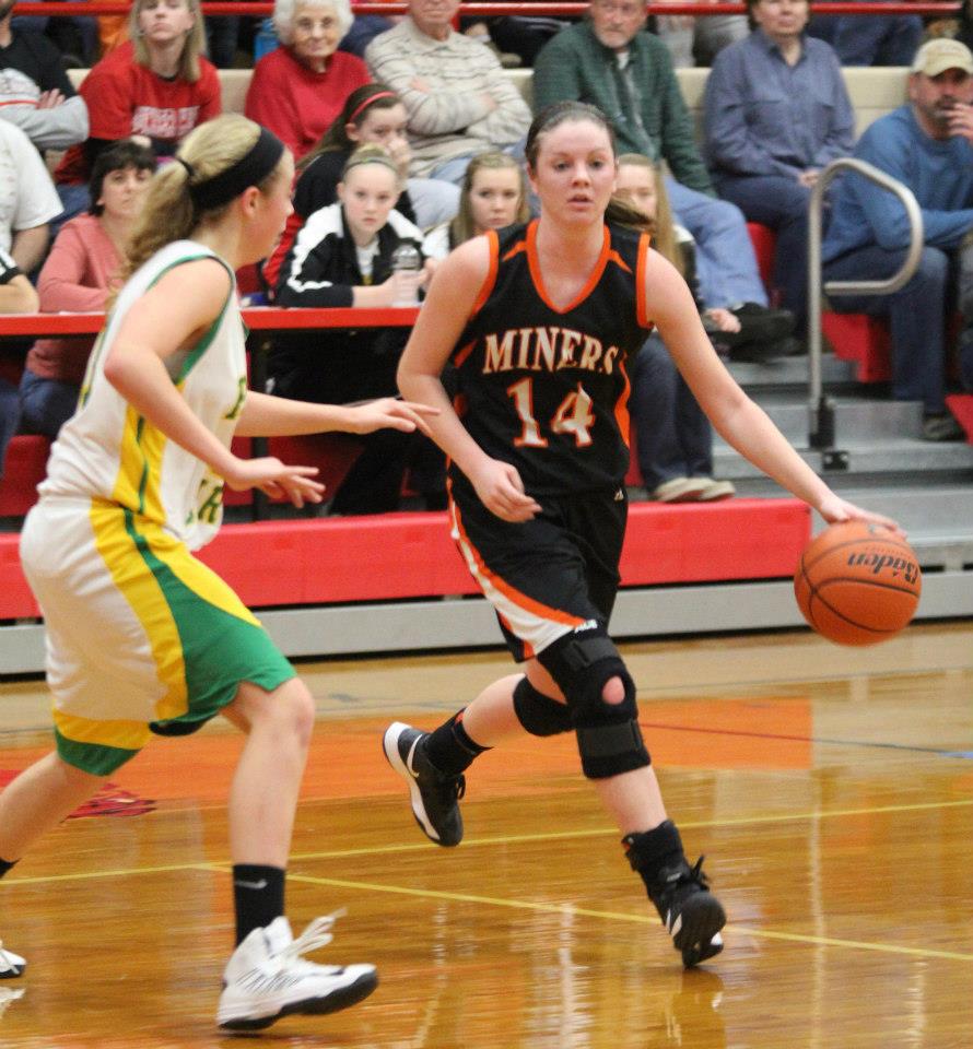 Alexis Burns dribbles around her defender for a better look at the basket. 