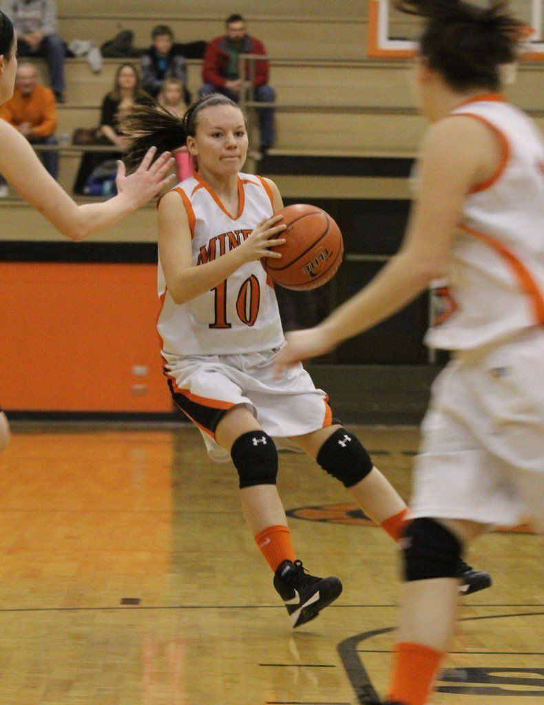 Tyler Ross looks for an open teammate in the girls' game versus Hillsboro this week. The girls came up short, 53-58.