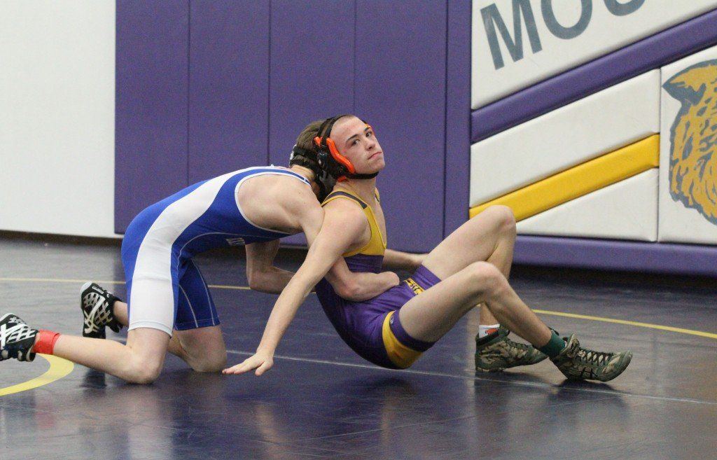 Josh Harvill attempts to regroup in his first match in the Mt. Olive Wrestling Invitational yesterday. 