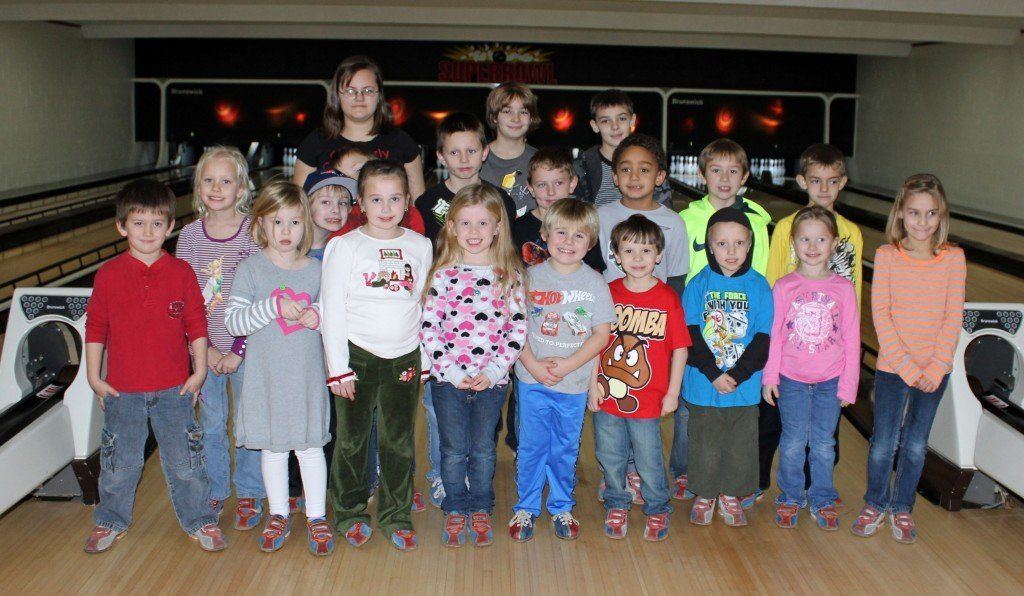 The junior bowling league at the Superbowl Bowling Alley in Gillespie stop for a moment of their game for a group photo. The group is in their 9th week of the league and have about 9 weeks left. 