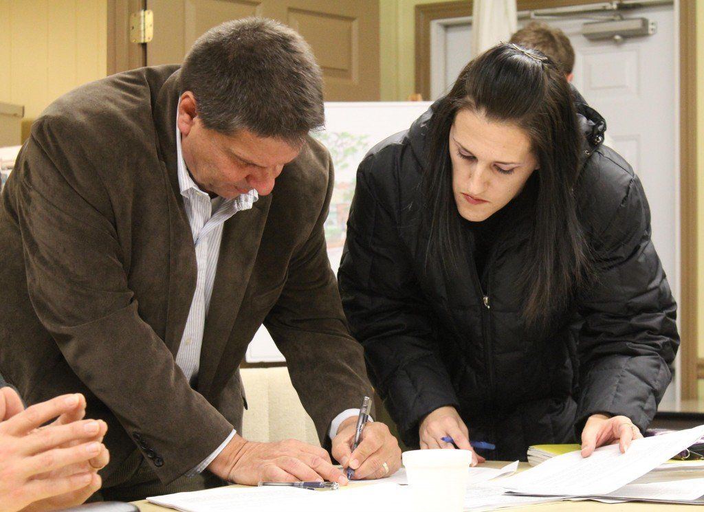 Rick Vertichio directs Sherri Cole where to sign stating she withdrew 3 of her 5 objections.