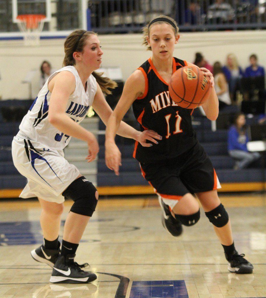 Kayli Morris drives the lane around a Greenville defender in an effort to try to gain a basket. The Lady Miners came up short, 47-55.