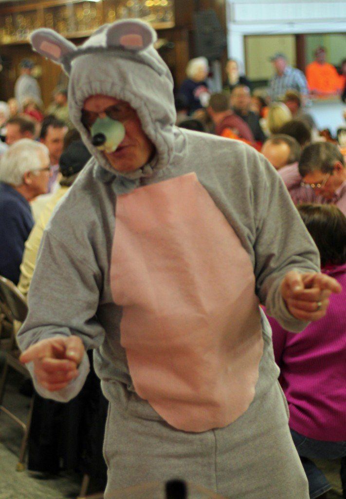 Mike Bertagnolli, boys' track coach, filled his role as a "mouse" Saturday evening. Bertagnolli urged supporters to get in on the action.