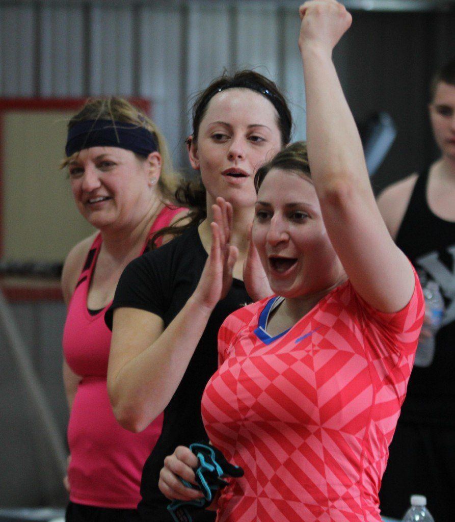 Nicole (Rauzi) Brawley cheers as a teammate scores a point for the ladies team. 