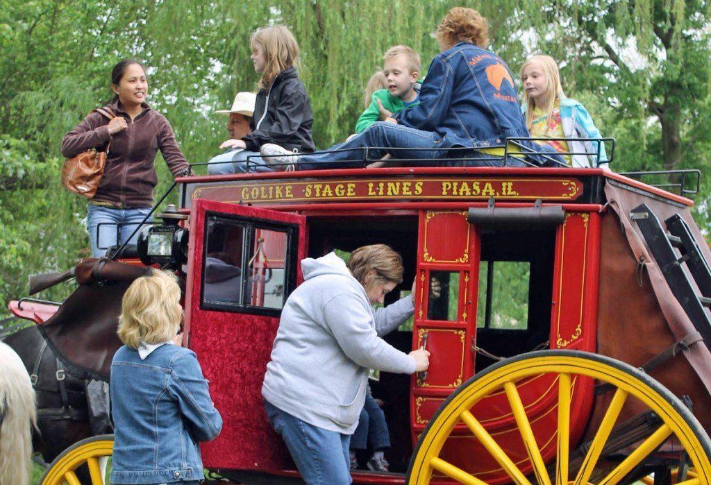 Guests board the Golike Stage Coach during the Macoupin County Historical Society's Spring Festival.