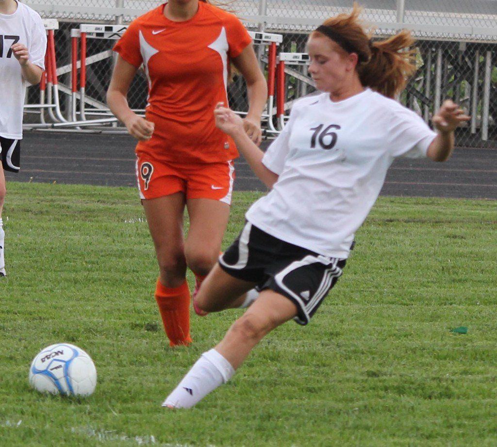 Maiya Bertolis outruns her defender and leans wide to take a shot at the goal in the girls' soccer game versus Hillsboro last week. The ladies won 9-0 in their first regional game versus Hillsboro, but got eliminated later in the week by Litchfield.