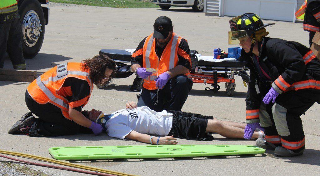 EMT personnel treat victims at the scene.