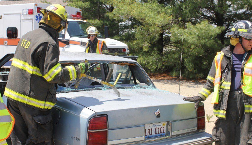 Crews break out windows to attempt to free victims.