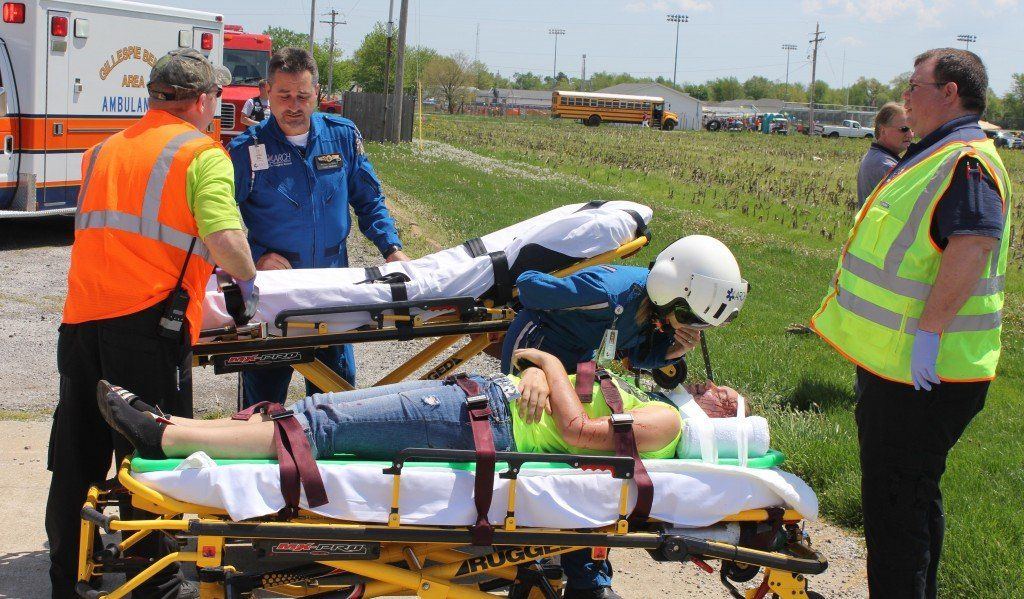 Local EMT personnel hand off the victim to ARCH personnel.