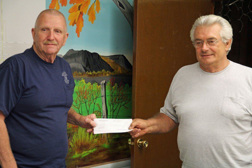 Larry Norville presented Mayor Hicks a check on behalf of the Gillespie-Benld Area Ambulance for dispatching services. 