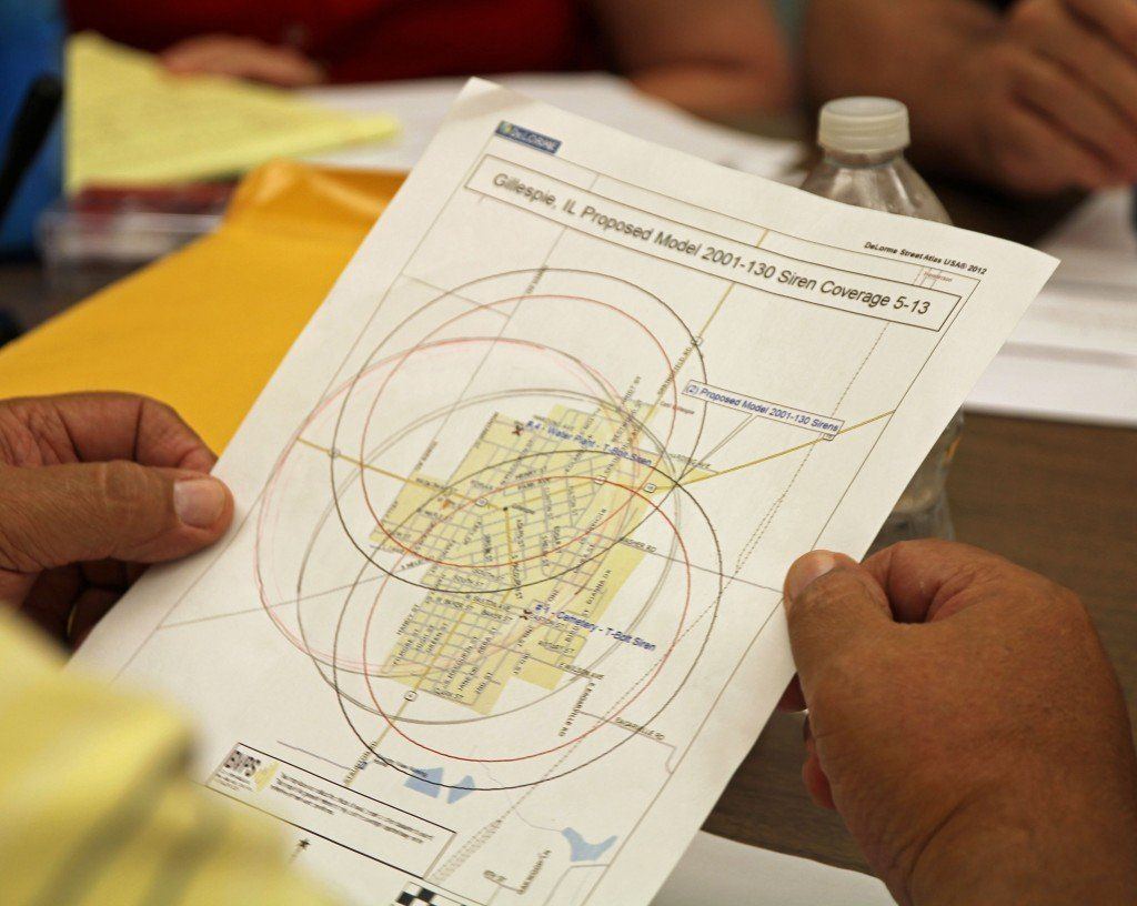 Alderman Gus Ottersburg reviews the areas the alert sirens will cover. Ottersburg disagreed with replacing the two alert sirens, but the motion passed anyway 5-3.