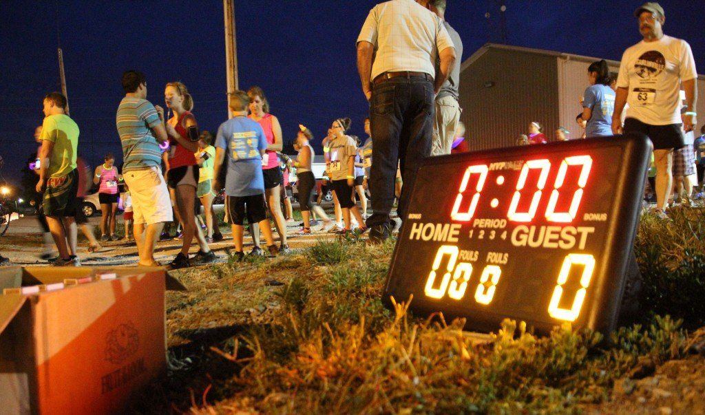 The timer for the Ageless GloRun sits along the starting line waiting for the race to start.