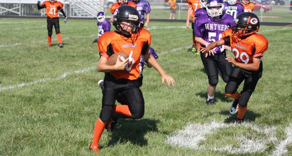 The seventh grade Mustangs rush in for a two point conversion. The seventh grade beat Litchfield by a large margin. 