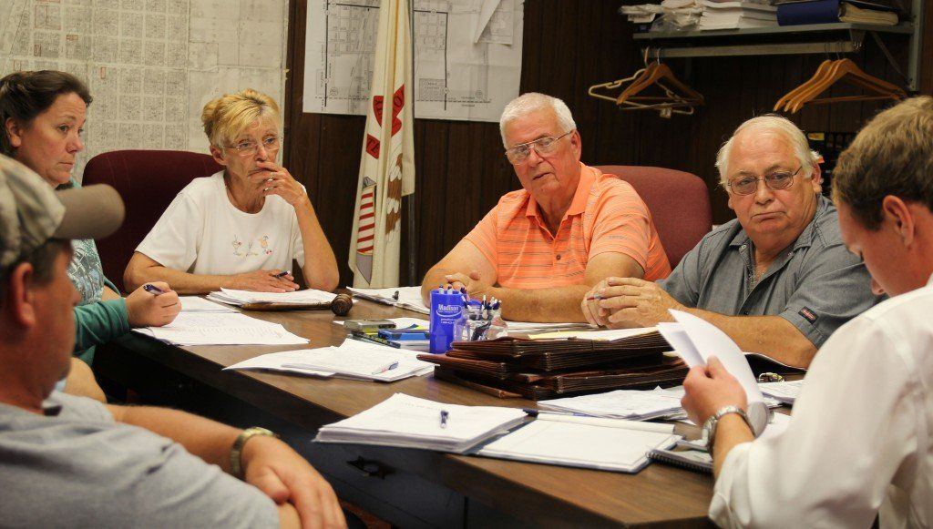 The council listens as Alderman Bernot explains the codification bids. 