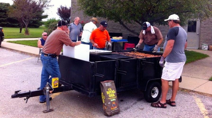 Volunteers cooked pork chops for citizens who turned out for Harvest Feast on Wednesday. Gillespie United Methodist Church organizes a Harvest Feast free to the community on the last Wednesday of each month.