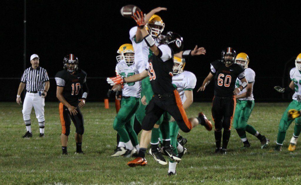 Eric Lancaster outruns his opponent to try to catch the pass from Michael Henderson Friday evening, but he was 6" short. The Miners still won 38-12 over Piasa.