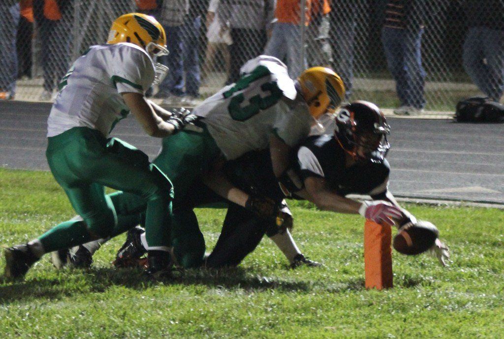 Chris Halpin tries to dive into the endzone to get a touchdown. The referees ruled the play out of bounds, but the Miners scored on the next play anyway. The Miners beat Piasa 38-12 Friday to move to 4-0.