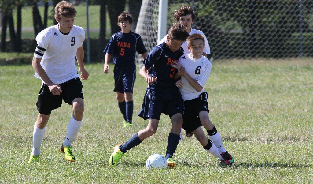 Colin Tieman and a Pana player bump and grind down the field to get control of the soccer ball. The Miners didn't let Pana be more aggressive, but they ended up losing 2-1.