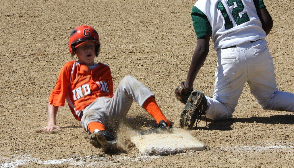 Joey Carter hastily takes third base in the Indians 3-2 victory Saturday afternoon over Madison.