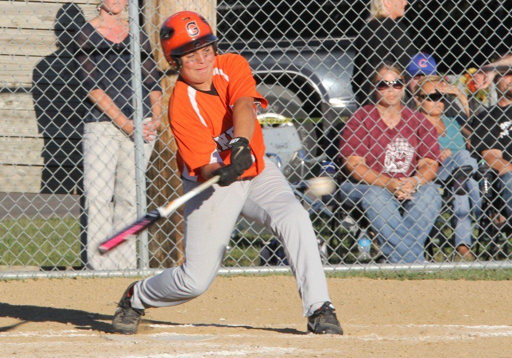 Trae Hall connects on a strike knocking the ball out of the infield in the regional championship game.