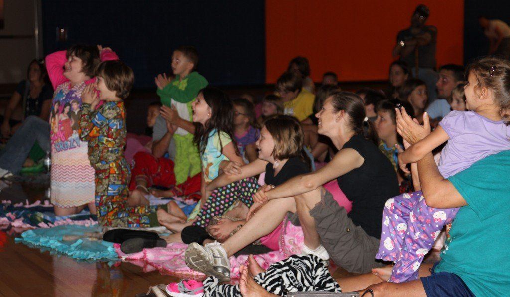 Parents and students alike laugh and carry on with the puppet show at Ben-Gil Elementary School's Family Literacy Night.