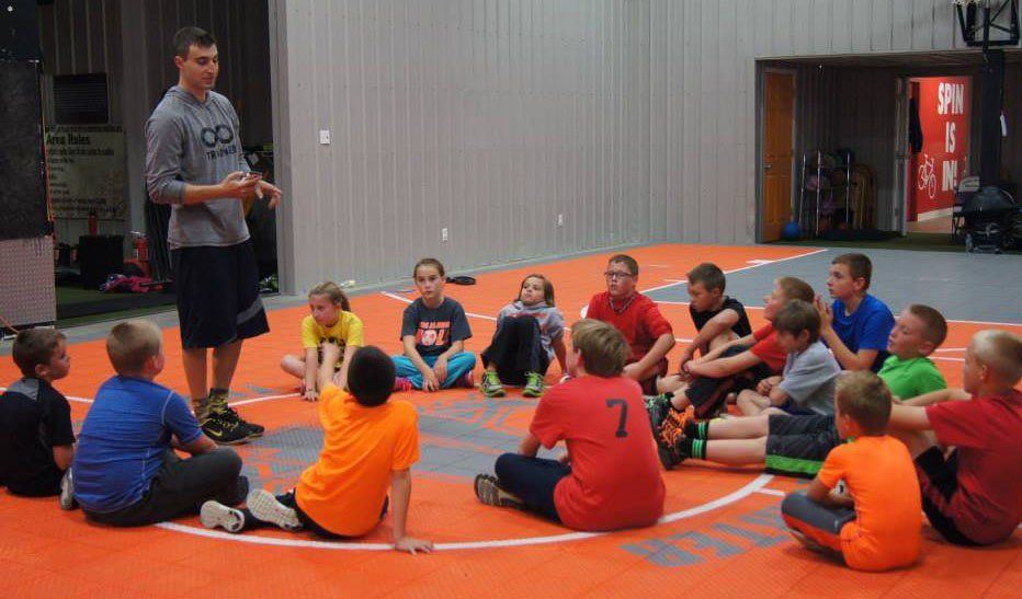 Pete Visintin, trainer at Ageless Fitness in Gillespie, leads the FUNdamental movement class for young athletes.