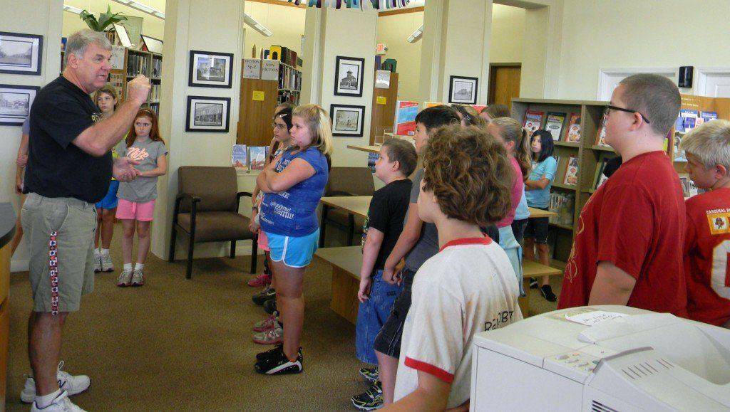 Steve Joyce, the librarian at the Gillespie Public Library, introduced himself to the students. He spoke about the history of the building and reviewed how to navigate and do research at the library.