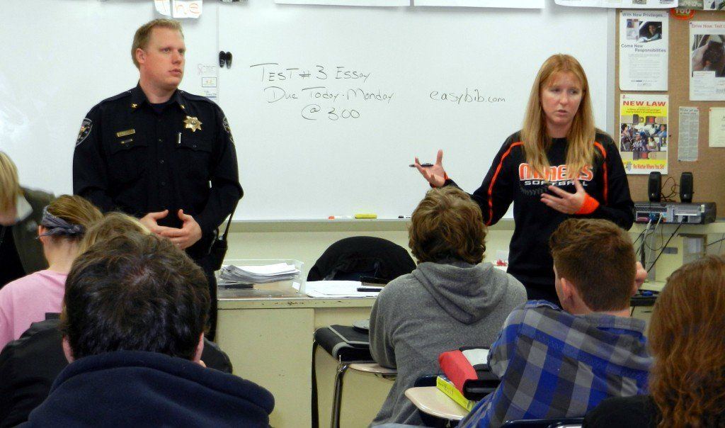 Jared DePoppe, chief of police in Gillespie, speaks to the sophomore class in Gillespie about school safety and school violence. Health instructor Holley McFarland, right, introduces DePoppe.
