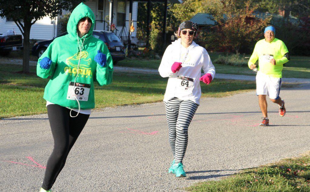 Meredith Osborn and Corrie Laux round the corner in the H.E.I.D.I. race Saturday morning.