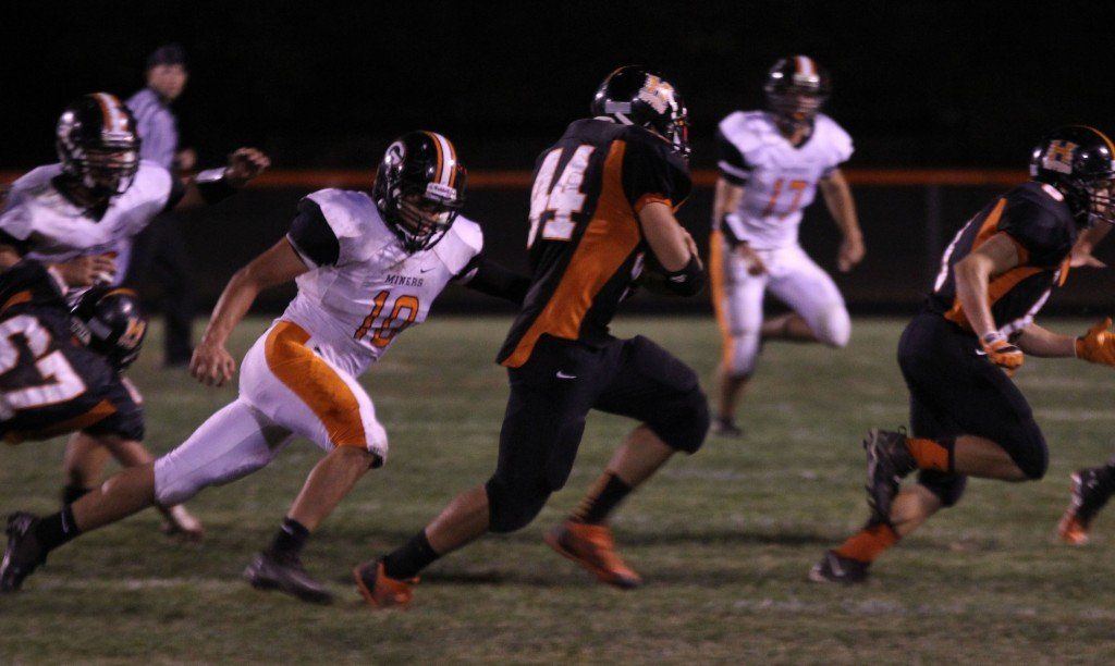 Logan Cooper runs after Hillsboro's quarterback and ends up tackling him in the backfield for a loss. Cooper finished the game with 12 tackles. 