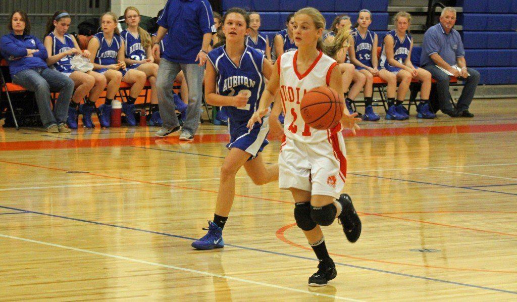 Mackenzie Kasarda dribbles the ball down the court for the Indians 8th grade basketball team. The Indians came up short to Auburn.