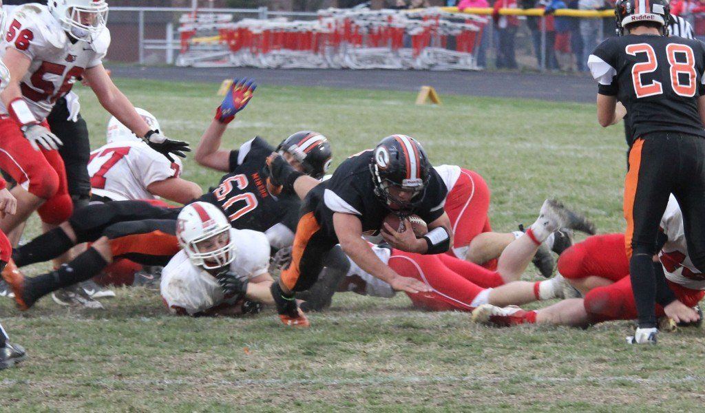 Derrek Tiburzi dives forward for a few extra yards in the Miner's last game of the season yesterday. Gillespie came up short to Staunton 14-30.