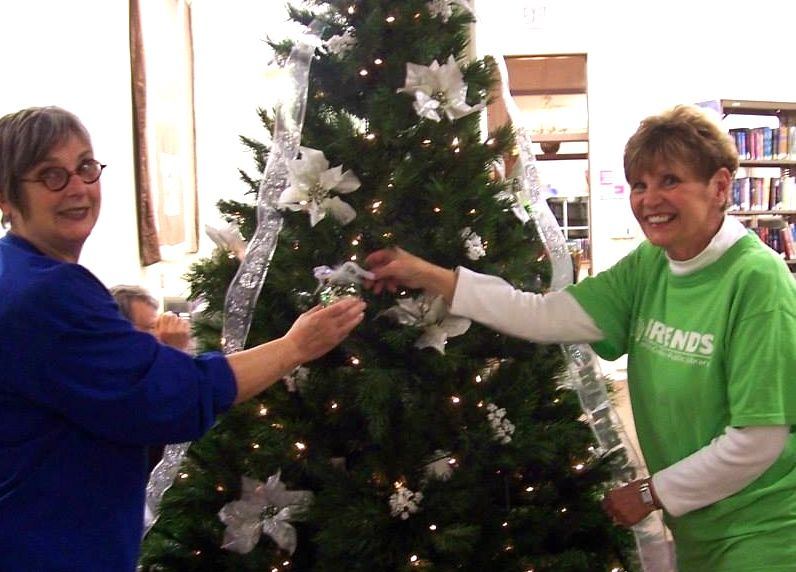 Volunteers from Friends of Gillespie Public Library put up the Tree of Remembrance and start to decorate it. Find out more about the Tree of Remembrance.