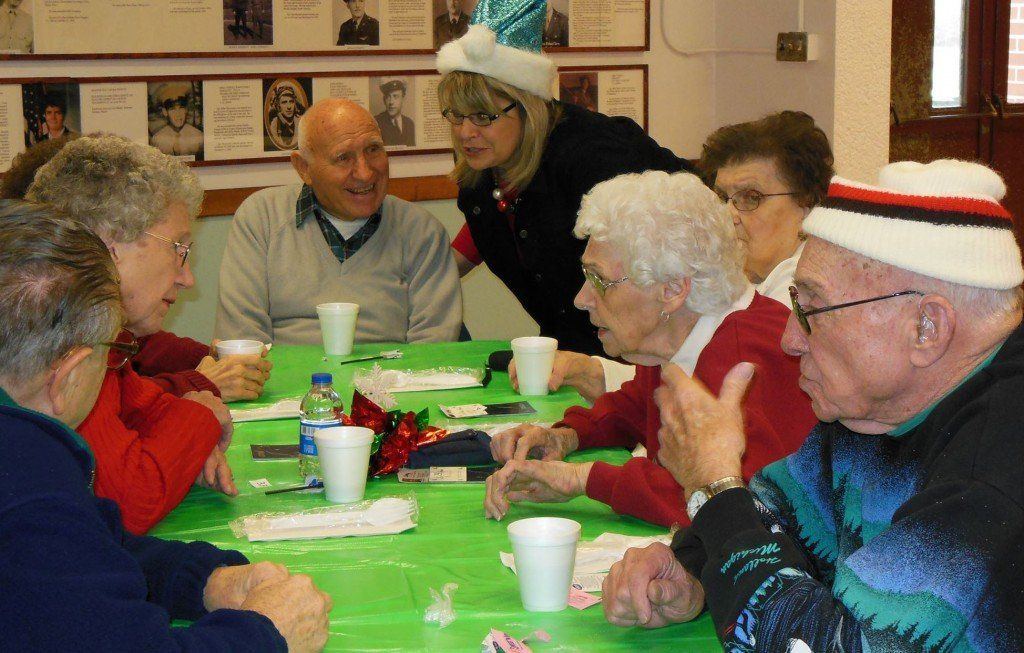 Kellie Vesper entertains senior citizens at Build Benld's annual senior citizen Christmas Dinner last weekend. 