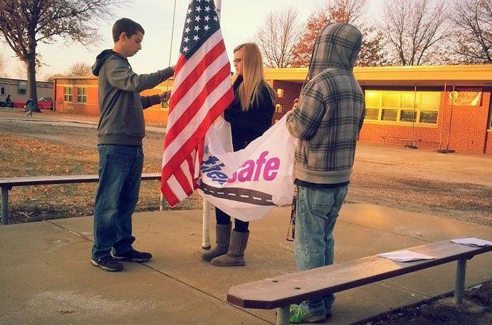 MPACT'D kicks off their Teen Safe Driving program by raising the Safe Driving flag underneath the American Flag. 