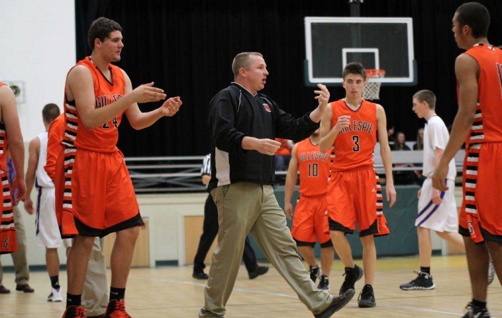 Assistant High School basketball coach Matt Brawner gathers the team during a timeout in the boys' game versus Valmeyer this week. The boys won 51-47.