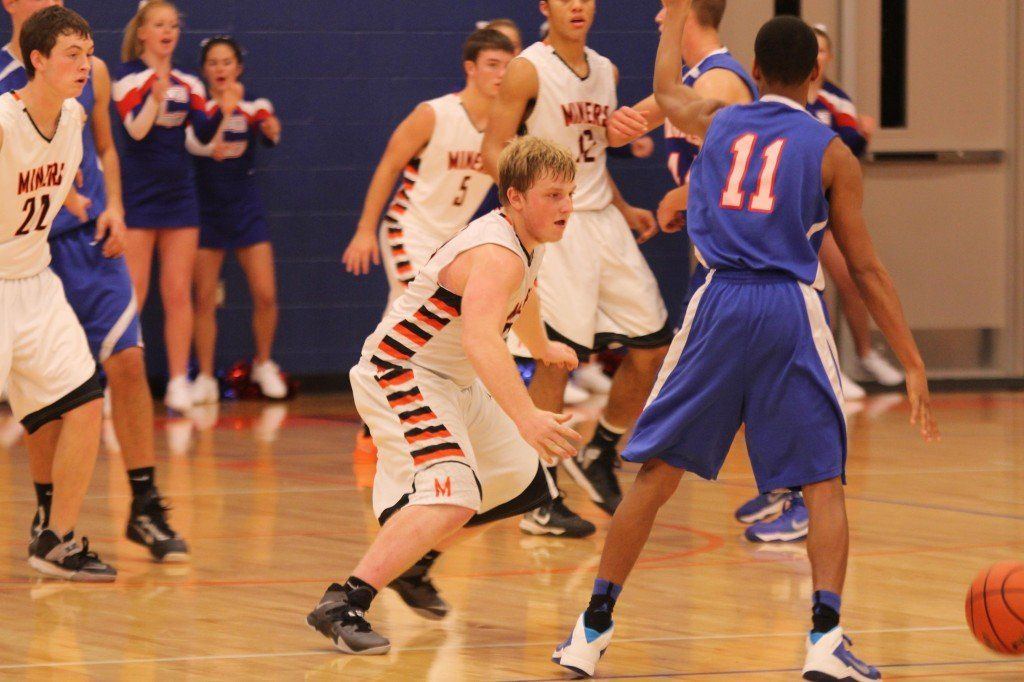 Eli Fox plays tough defense on his Carlinville opponent in the boys' 62-63 loss to Carlinville last week.