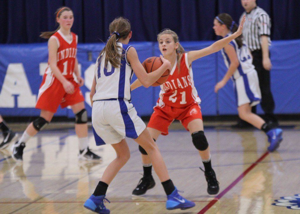 Mackenzie Kasarda plays defense on her Auburn opponent in the middle school girls' regional championship. Gillespie fell to Auburn to get second place in regionals.