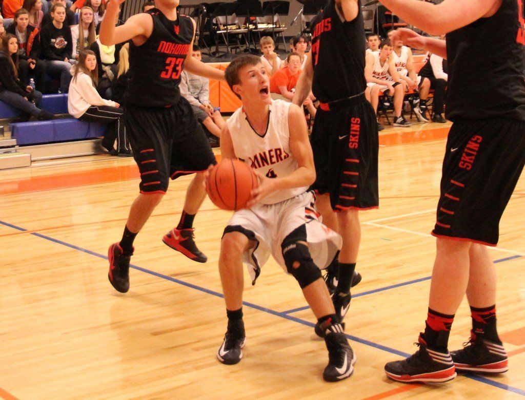 Evan Price shot fakes two Nokomis defenders before nailing the basket. 
