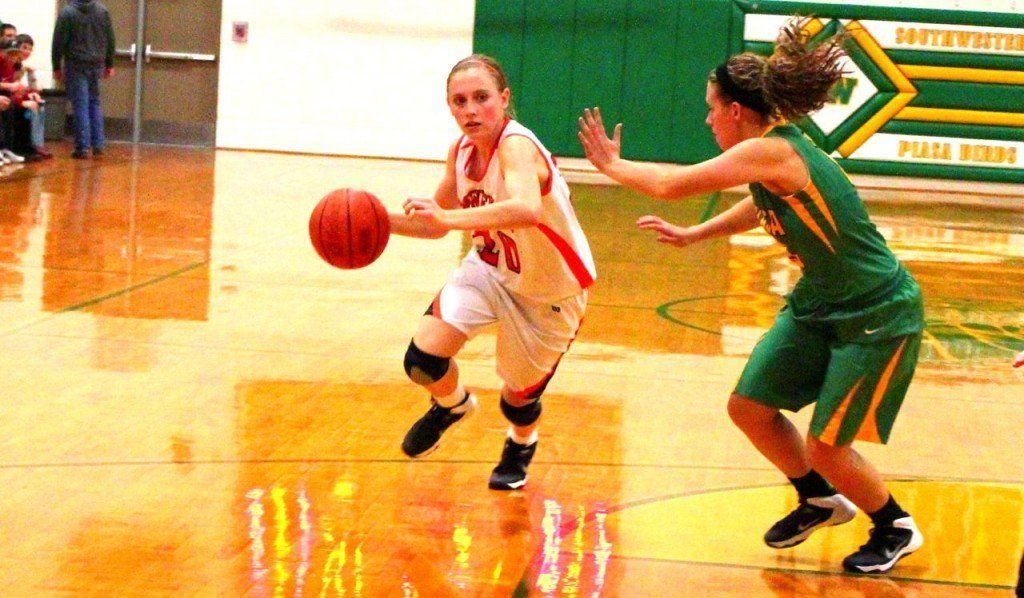 Amanda Schmidt gets playing time as a freshman as she dribbled the ball down the lane in the picture.
