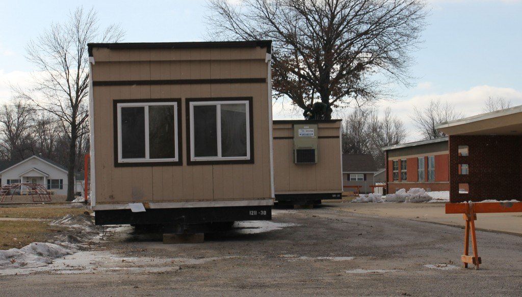 Crews continue working on removing the modular buildings behind the middle school. 