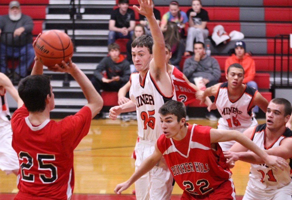 Jacob Alepra tries to block his opponent's shot in the Miners' 60-40 win over Bunker Hill. 