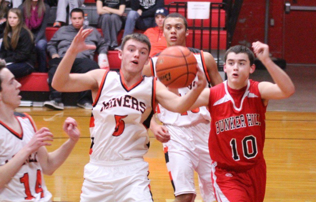 Blake Peterson and a player from Bunker Hill go after possession of the ball. 