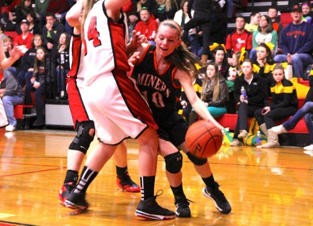 Tyler Ross tries to dribble around her defender in the lady's 38-40 loss to Bunker Hill yesterday to get 4th place in County. 