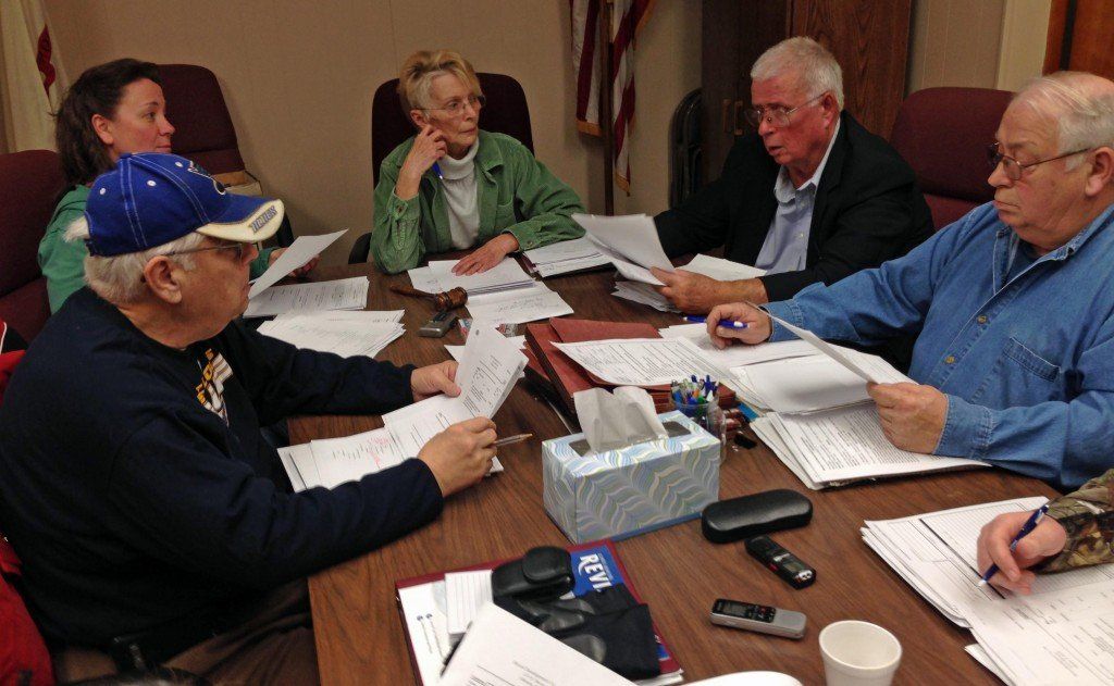 The council reviews the police costs spreadsheets.